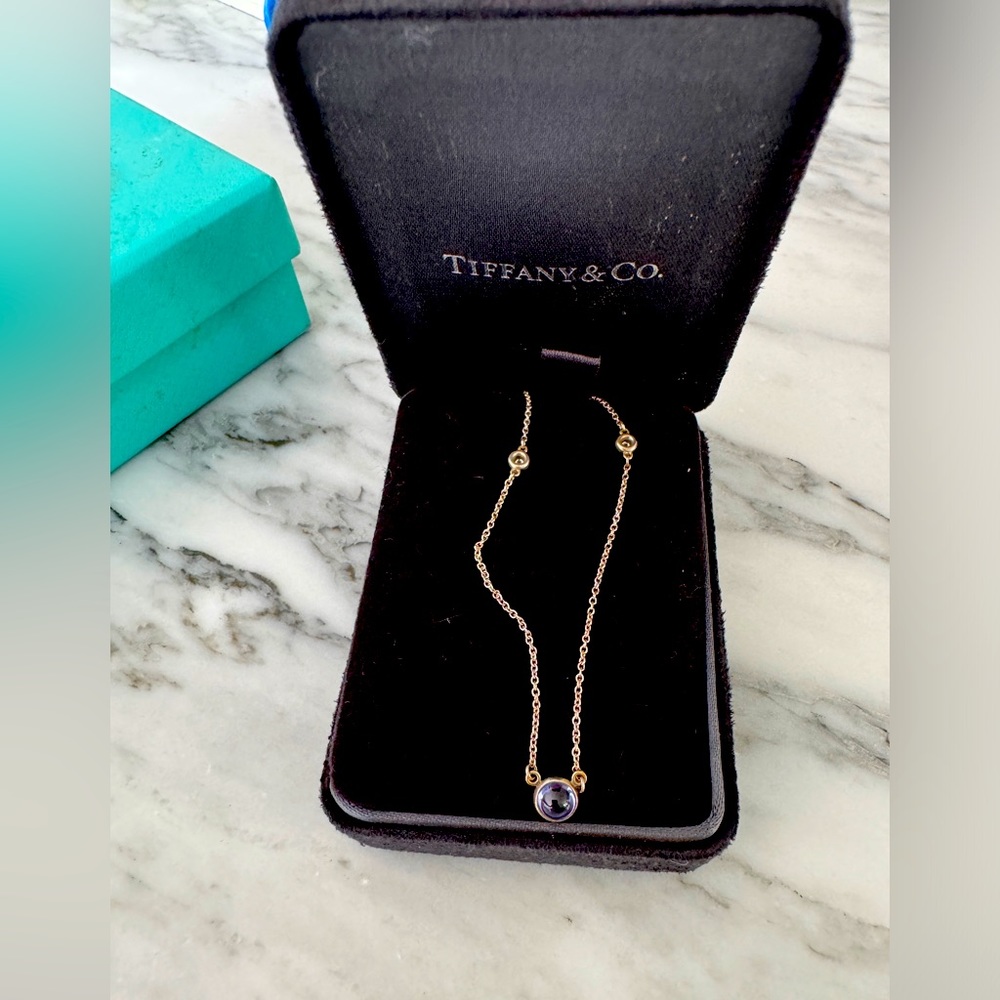 Tiffany purple stone with two diamond. Silver